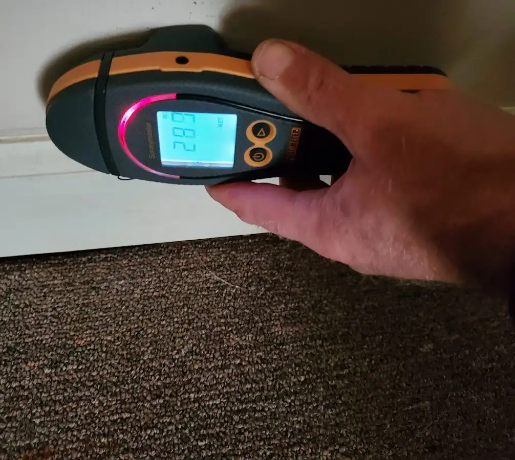Moisture detection at baseboard during Storm Damage Restoration in New Britain